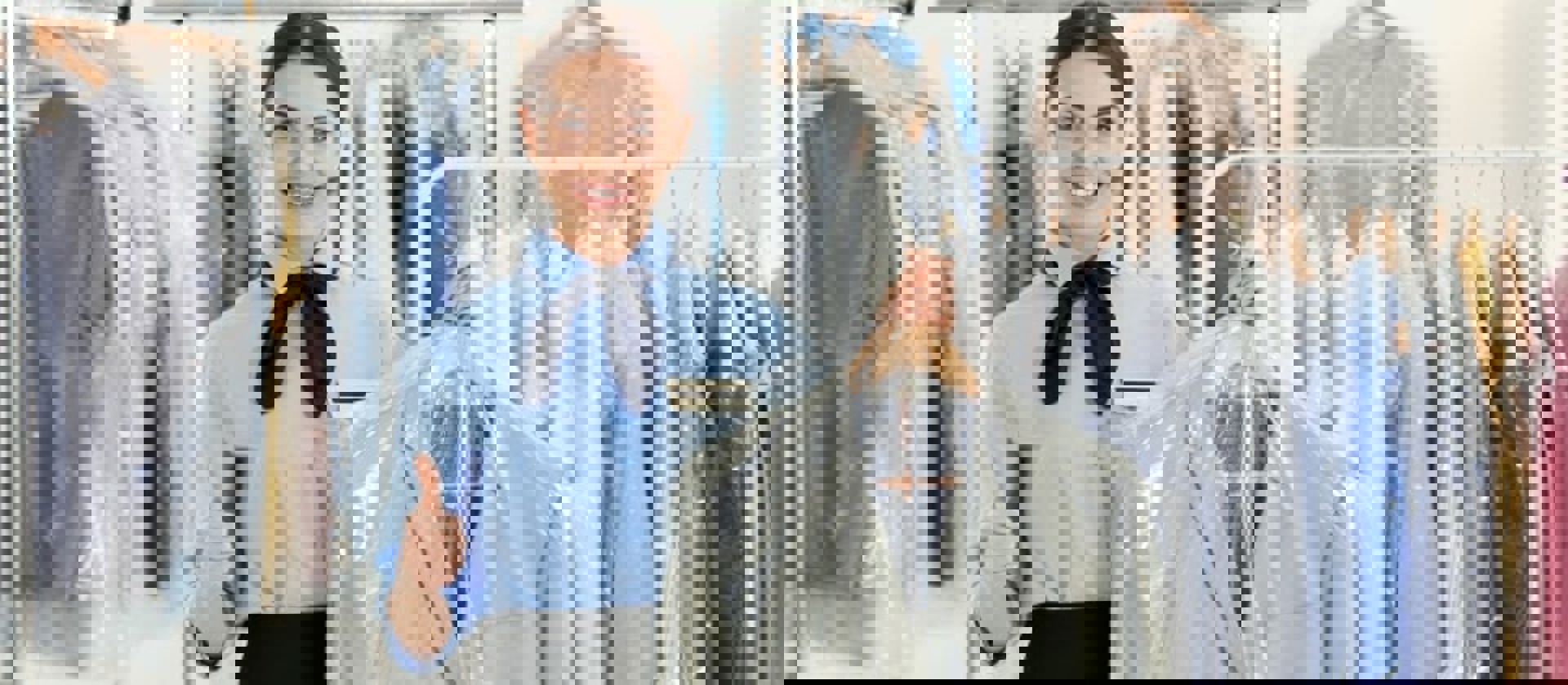 Lady Gesturing Thumbs Up While Holding Dry Cleaning Min 1